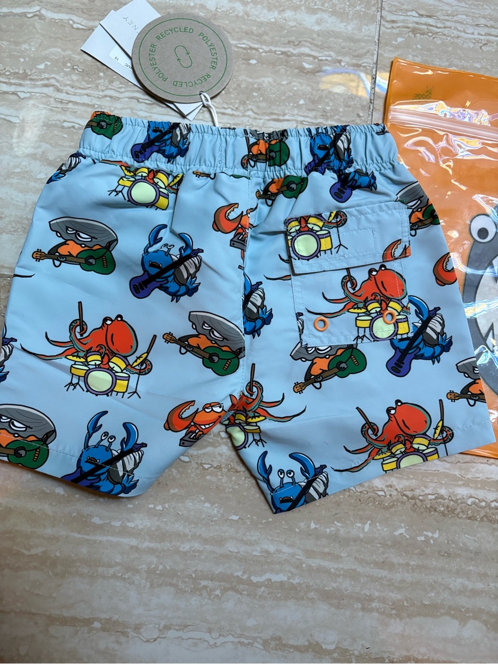 Stella McCartney Kids Light Blue Crab Print Swim Shorts with Orange Drawstring